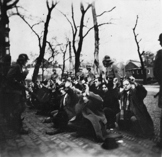Jewish men forced to their knees on the Jonas Daniël Meijerplein during a German raid